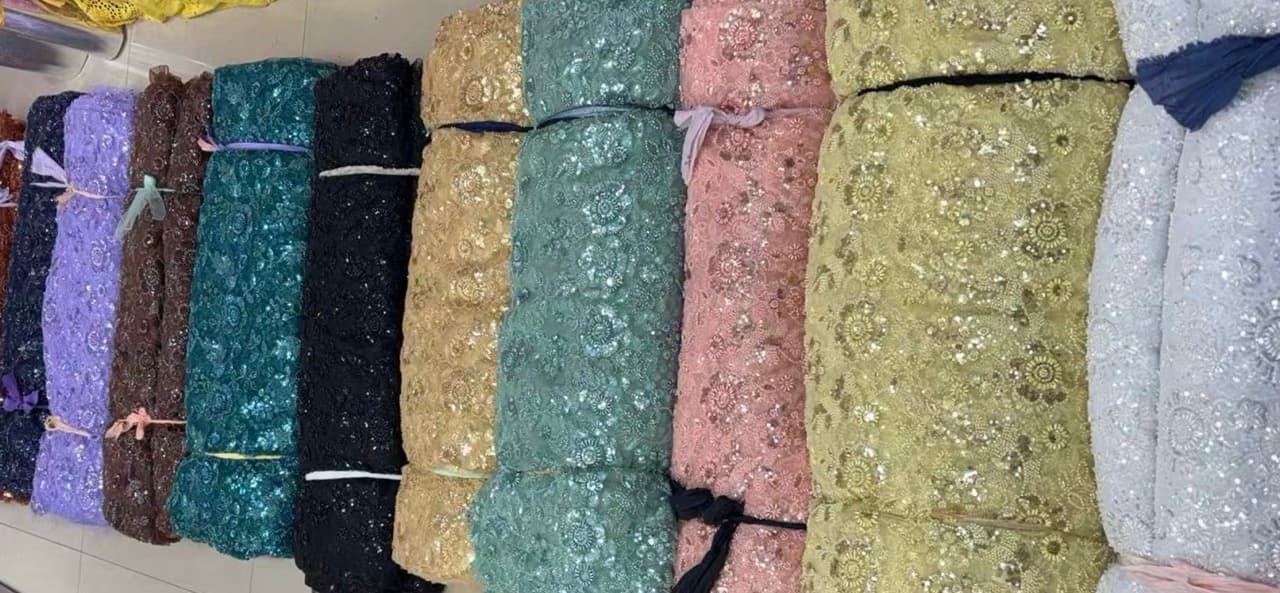 Various affordable lace fabrics displayed, showing texture, patterns, and quality finishes