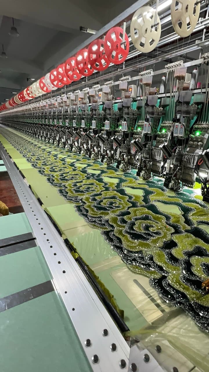 Various fabrics with different textures and patterns displayed